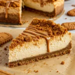 No-bake Lotus Cheesecake Dessert topped with melted Biscoff spread and cookie crumbs