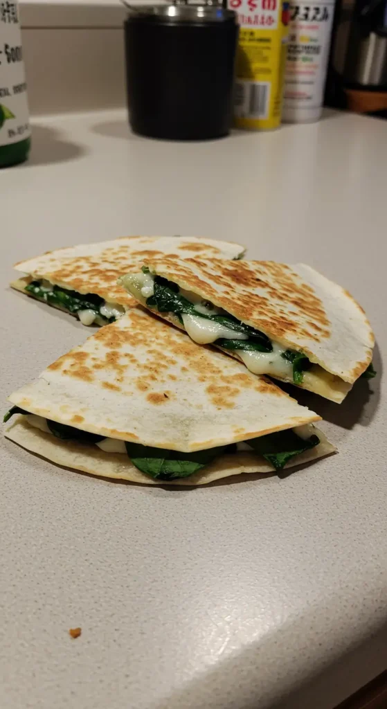 Crispy Spinach and Feta Quesadillas with fresh spinach and melted cheese