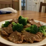 Chinese Beef and Broccoli stir fry with tender beef and crisp broccoli over rice