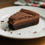Chocolate Mousse Brownies with layered mousse and ganache on a white plate.