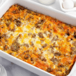 A golden-brown Egg Sausage Crescent Roll Casserole fresh from the oven, showing flaky crust and cheesy topping.