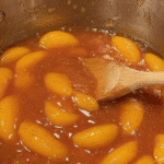 Close-up of freshly sliced ripe peaches for pie filling.