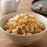 Close-up of perfectly caramelized onions in a Dutch oven, rich and deeply golden brown.