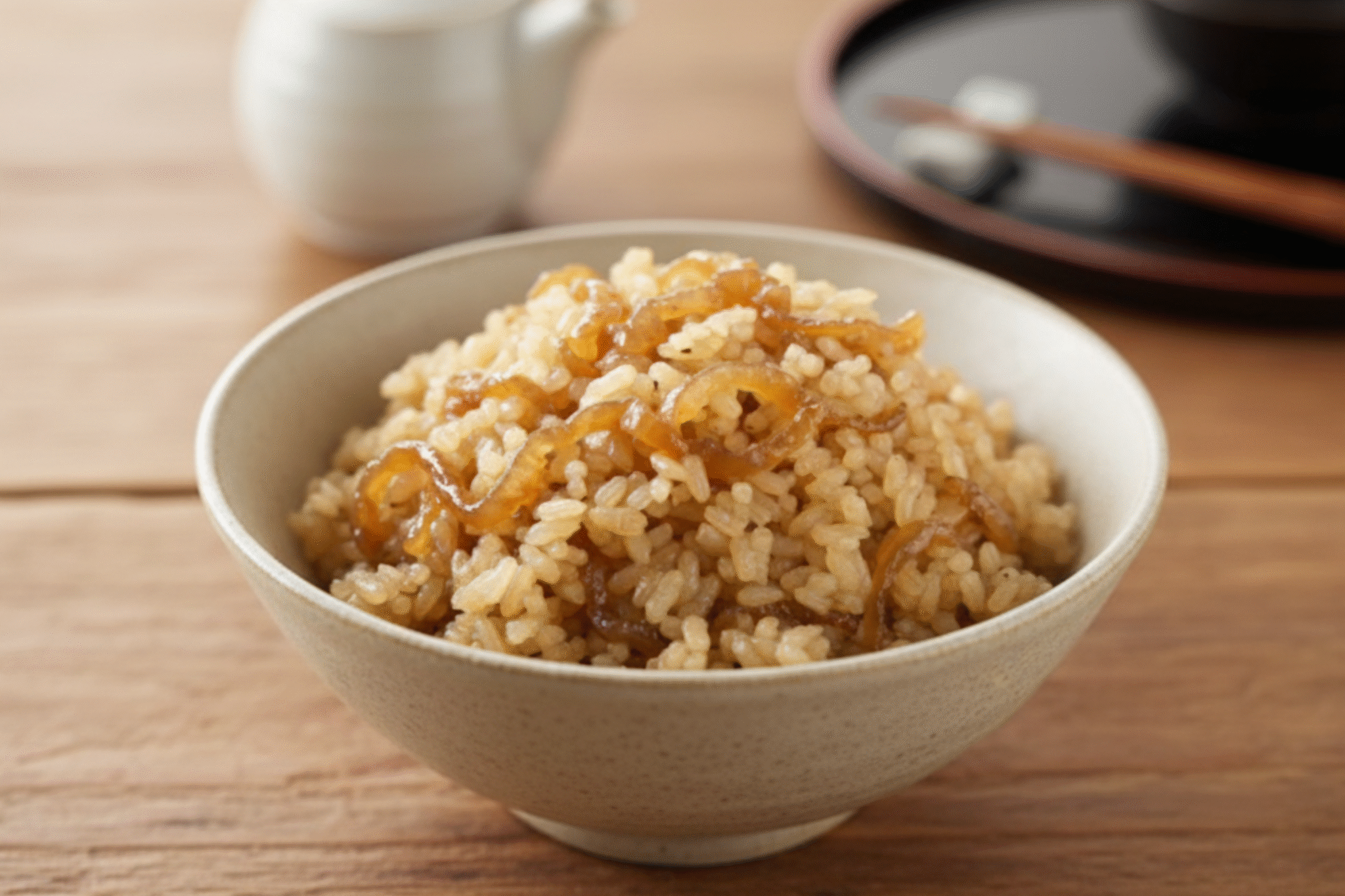 Close-up of perfectly caramelized onions in a Dutch oven, rich and deeply golden brown.