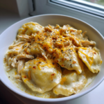 Garlic butter shrimp scampi pasta with creamy ravioli, shredded chicken, and melted cheese.