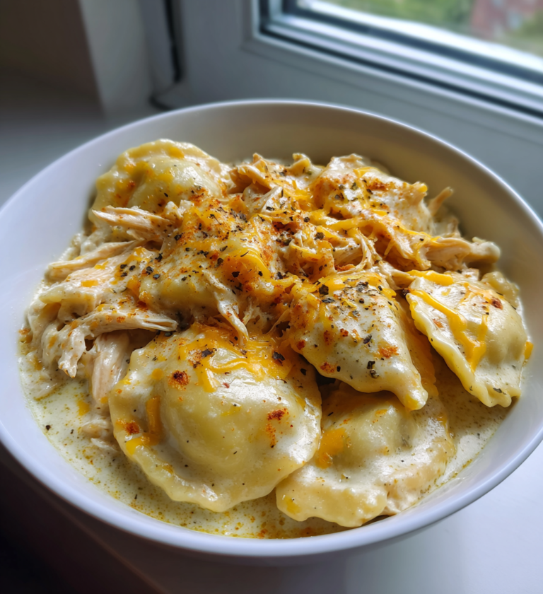 Garlic butter shrimp scampi pasta with creamy ravioli, shredded chicken, and melted cheese.